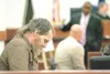 ROBERT DeBERRY/Frontiersman Donald Voorhis, left, bows his head
as he listens to his defense attorney, Herman Walker, questions
U.S. Fish and Wildlife Officer Christopher Johnson Thursday.