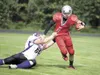 ROBERT DeBERRY/Frontiersman Wasilla quarterback Ben Fielder
scrambles for a first down as Skyview’s DJ Diaz tries to make the
tackle Saturday at Wasilla High School. Robert DeBerry