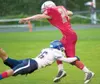 Wasilla Warrior Tyler Polis breaks past North Pole's Chris
Vannoy for a touchdown in the final seconds of the first half
during Friday's game at Wasilla High School. (ROBERT
DeBERRY/Frontiers