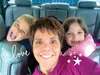 Jenn Mikkelsen smiles for a selfie with her twin 7-year-olds Ryan, left, and Reese. The children and their mother’s parents will join Mikkelsen soon in Houston, Texas as she undergoes a stem 