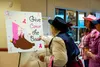 A Breastival attendee participates in one of the games included in the Valley Radiation Therapy Center booth at Mat-Su Regional Medical Center on Oct. 19. Breastival is an event designed to c