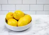 Lemons may look bright and sunny on your kitchen countertop, but they'll stay fresher longer inside a bag in the refrigerator.