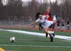 Kenai's Kylie Morse sends Wasilla's Teyonnah Williams sprawling during their match Friday evening. The typically physical game ended in a 1-1 tie. CAITLIN SKVORC/Frontiersman.com