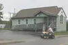 A man drives an ATV along a city street in downtown Wasilla recently. The ban of ATV use in Wasilla has become a controversial subject. HEATHER A. RESZ/Frontiersman