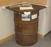 A burn barrel constructed to state specifications sits in the lobby of the state Division of Forestry office. The state requires that all burn barrels be permitted during the open burning sea
