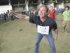 ROBERT DeBERRY/Frontiersman Steve Hubacek celebrates Friday at
the Alaska State Fair Giant Cabbage Weigh-Off when he broke his
world record with a whopping 127-pound vegetable. On Wednesday,
