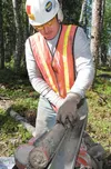 PND Engineers Inc. employee Curt Johnson bags dirt samples at the site for the new high school in the Knik Goose Bay Area. The samples will be studied for information on water content, densit