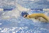 ROBERT DeBERRY/Frontiersman Palmer Moose Noelle Graham grabs a
breath of air as she competes in the girls’ 400-yard freestyle
relay at the Colony Invitational swim meet Saturday in Palmer. Ro
