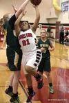 Houston senior Ashley Apangalook tries to avoid the block during a loss to Seward Jan. 29. Houston bounced back after losses to Seward and Nikiski to beat Homer Jan. 31 at Houston High. Court
