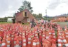 ROBERT DeBERRY/Frontiersman Silvia Carlson works on staging
hundreds of traffic candles behind the old Nugen’s Ranch complex
Friday morning for the Seward Meridian Parkway expansion
project. 
