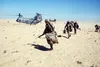 Marines of Co. C, 1st Bn., 2nd Marine Div., move out on a mission after disembarking from a Marine Medium Helicopter Squadron 263 (HMM-263) CH-46E Sea Knight helicopter during Exercise Immine