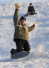 Dakota Rood, 12, tries to catch some air on his sled as friend
Austin, Robertson, 11, watches and waits his turn Monday at Valley
of the Moon Park in Wasilla. Monday brought clear skies, suns