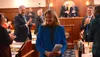 Sen. Lisa Murkowski, R-Alaska, smiles on Tuesday, March 18, 2025, as she exits the Alaska House of Representatives following her annual address to the Alaska Legislature. James Brooks/Alaska 