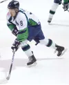 Alaska Avalanche forward Zach Smith moves the puck down the ice
during the final seconds of the second period Thursday against the
Dawson City Rage at the Palmer Ice Arena. (ROBERT
DeBERRY/Fr