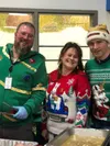 Ryan Geagel, Cheryl Nichols , and Chris Miller pose for a photo in holiday sweaters. Courtesy photo