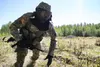 Alaska Army National Guard Spc. Innocent Bennett, B Company, 1st Battalion (Airborne), 143rd Infantry Regiment, bounds during an individual-movement techniques lane at the Alaska National Gua