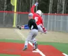Wasilla's Cyruss Lovell beats Palmer's Keagen Norman to the bag at a play at first during an 11-7 Wasilla win over the Moose Monday at Wasilla High School. Jeremiah Bartz/Frontiersman