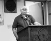 Johnny Murdock tells a crowd that local firefighters raised
nearly $64,000 for Sept. 11 tragedy victims. Photo by RINDI
WHITE/Frontiersman.