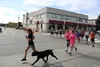 Jess Demarco and her dog Bruno lead the Happy Runners. Photos by Tim Rockey/Frontiersman