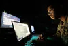 U.S. Marine Corps Lance Cpl. Ram Francis, a data systems administrator with Headquarters Battalion, 23rd Marine Regiment, from San Francisco, monitors network traffic and activity on Fort Pic