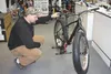 Tony Hardwick admires a carbon frame Lamere at Alaska Bicycle Center in Wasilla. Winter fat-tire biking continues to gain in popularity in the Mat-Su Valley. STEVEN MERRITT/Frontiersman