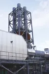 Exhaust stacks at the Eklutna Generation Station catch the afternoon sunlight Friday. The MEA-operated facility will likely be 40 percent operational on deadline, officials said, requiring th