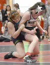 Redington's Alejandra Roman wrestles Nikiski's Addison Perkins in the championship at 138 girls at the Kachemak Conference wrestling tournament at Kenai Central High School in Kenai, Alaska, 