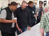Alaska Department of Transportation's Al Burton. center, was one of a handful of DOT personnel at the Wasilla Senior Citizens' complex Tuesday afternoon. The group was on hand to review and a