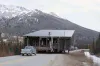 The Denali hotel's former auditorium is trucked down a highway
from the national park to Healy, where it is being used by a
church. The transfer, made last spring, is part of the park's
commi