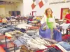 Amber, a 15-year-old student at Valley Pathways in Palmer,
peruses mounds of clothing and other items brought to Wasilla
Middle School during the Holiday Luncheon for Homeless Youth
Saturday 
