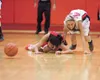 Wasilla sophomore Machia Toews scrambles after the ball during
the Warriors’ game against the Juneau-Douglas Crimson Bears in
Monday action of the Doc Larson’s Roundball Classic at Wasilla Hi
