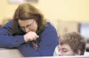 Math instructor Susan Foster helps students with an assignment at American Charter School. The Mat-Su Borough Assembly decided to increase by $139,000 the money it’s giving to charter schools