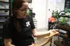 Jonathan Huntington shows off one of the many snakes she houses in her garage that doubles as an emporium. Jacob Mann/Frontiersman