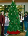 CASEY RESSLER/Frontiersman Hospice of Mat-Su volunteers Pat
Karella, Sharon Seagondollar, Pat Shier and Luci Smeenk stand by
the tree at the Cottonwood Creek Mall. A second tree is located at