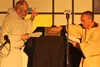 Two monks put aside the scrolls and try to figure out how to use a book for the first time. JACOB MANN/Frontiersman