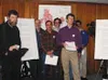 Chris Whittington-Evans, front right, along with others at the
meeting, spoke out in favor of increased property rights, lease
buybacks, a mandatory best-interest finding, studies of existing