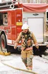 Michael Keenan, assistant fire chief at the Central Mat-Su Fire
Department, walks toward the scene of a fire off Knik-Goose Bay
Road Wednesday morning. Submitted photo.