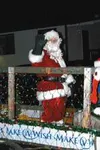 Santa waves to the crowd during the parade of lights Saturday in
Palmer. Photo by CASEY RESSLER/Frontiersman