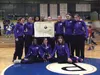 The Teeland Middle School varsity girls basktball players pose with head coach Ryan Engebretsen after winning a title at the Valley Invitational at Palmer Junior Middle School earlier this mo