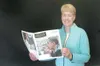 GREG JOHNSON/Frontiersman Beverly Smith holds a recent Christian
Science Monitor, the flagship publication of the church. The
Monitor publishes a Web edition daily and a weekly print
edition.