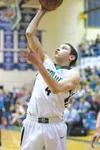 Colony junior Damien Fulp goes to the basket during the Northern Lights Conference tourney in Soldotna last week. Fulp was named the NLC Boys Player of the Year. ROBERT DeBERRY/Frontiersman.c