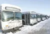 ROBERT DeBERRY/Frontiersman Seven used People Mover buses sit on
the Tew’s lot near Houston. Mokie Tew plans on using the buses for
a new Valley Mover bus service scheduled to begin in March.