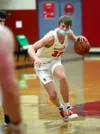 Wasilla's Andrew Devine brings the ball up the floor during a win over Colony. Courtesy of Bruce Eggleston