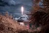 A SpaceX Falcon 9 rocket carrying NASA astronaut and Marine Corps Col. (Ret.) Douglas Hurley and fellow crew member Robert Behnken is seen in this false color infrared exposure as it launched