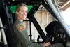 Capt. Jennie Seibert, 459th Airlift Squadron UH-1N Huey pilot and chief of training, sits in a UH-1N at Yokota Air Base, Aug. 4, 2021. Seibert helped translate between the Airmen and Moroccan