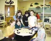 Allie Grazulis, Andrea Lund, Shannon Browning, Jeff Ford, Dani
Buckley and Amber Klinger admire one of four finished simulators,
which NASA allows the school to keep with hopes that the schoo