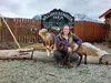 Williams Reindeer farm manager, Lauren Waite with a 2-week-old calf named Elsa and family farm dog Kodiak. Photos by Jacob Mann/Frontiersman