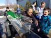 Dr. Yoo Yin Kim of the National Tsunami Warning Center welcomed visitors to Saturday's open house at the Palmer facility, and with the help of a couple of associates and a great visual, was a