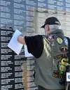 Martin Robert Grossman looks at names of those recognized on the Veterans Wall of Honor in Wasilla. Katie Stavick/Frontiersman