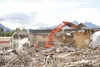 JJ HARRIER/Frontiersman Demolition crews work through a giant
pile of construction rubble while tearing down the former
Cottonwood Creek Mall in Wasilla on Wednesday.